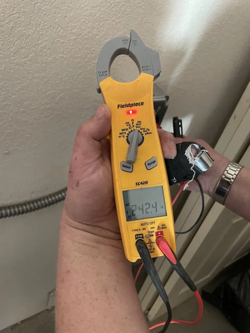 Voltage testing with clamp meter during Circuit Breaker Repair in Northridge